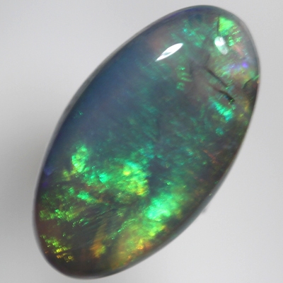 SOLID BLACK CRYSTAL OPAL Crisp green and orange with side flashes of red
